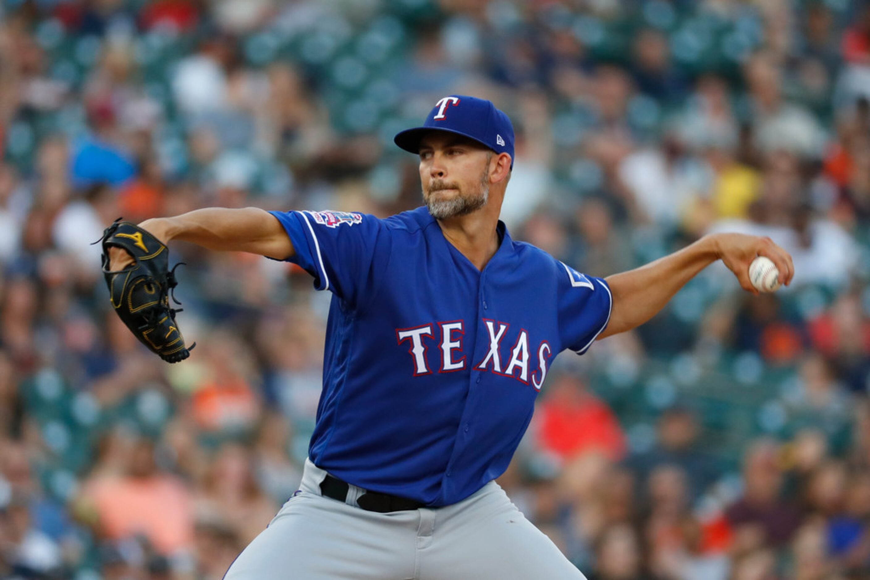 Texas Rangers pitcher Mike Minor throws in the fourth inning of a baseball game against the...