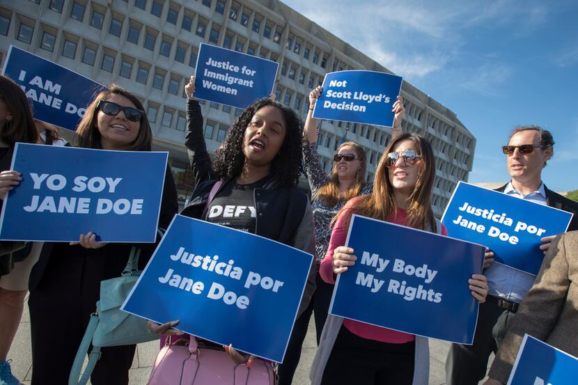 Activists with Planned Parenthood demonstrate in support of a pregnant 17-year-old being...