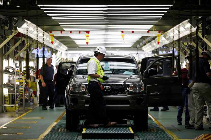 A Toyota Tacoma truck undergoes final inspection at the Toyota Manufacturing Plant in San...