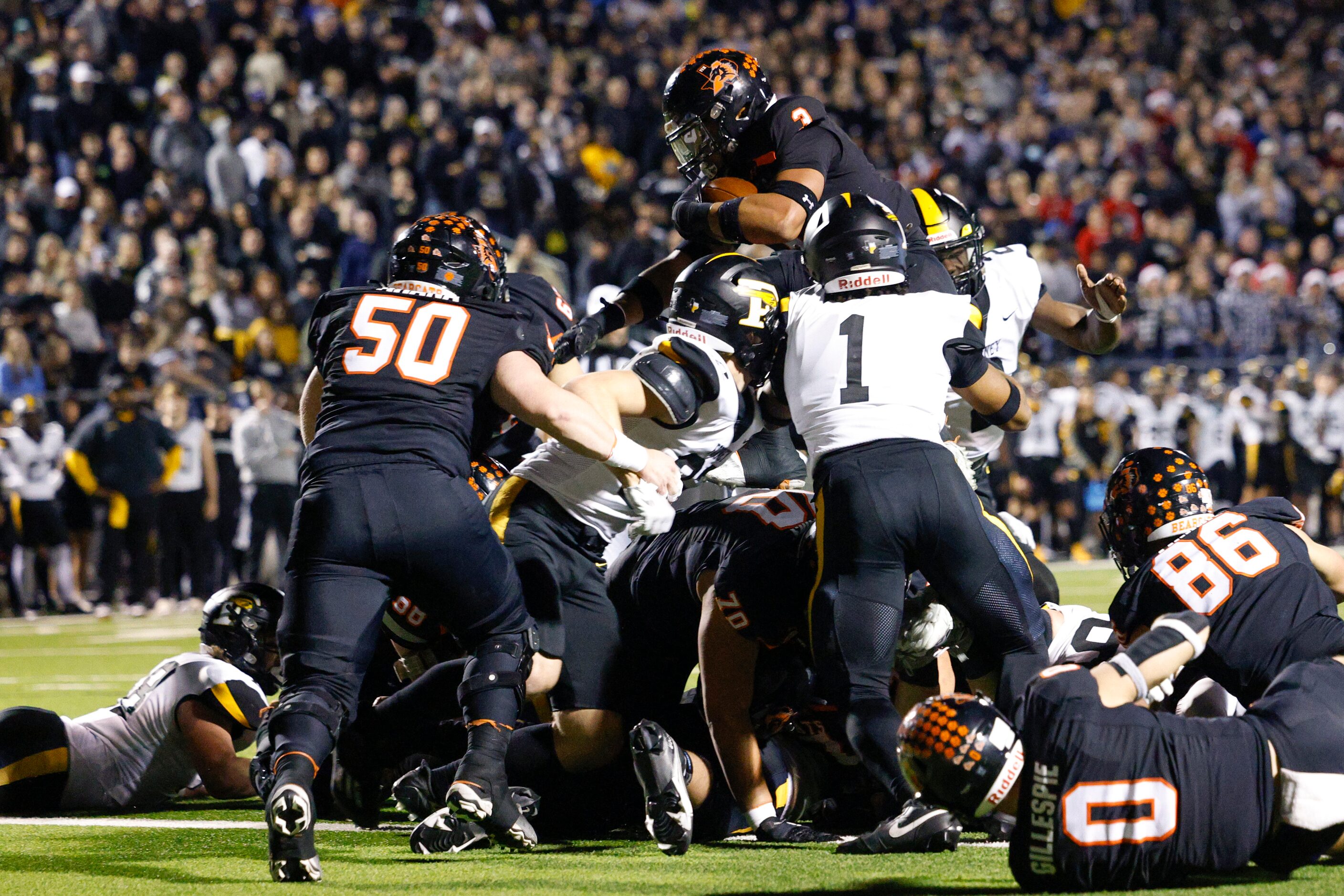 Aledo running back Davhon Keys (3) leaps over the line for a touchdown during the first half...