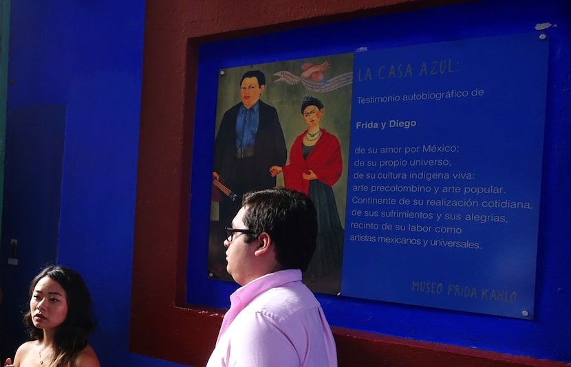 Tourists stand at the entrance to La Casa Azul, the Museo Frida Kahlo, where artists Frida...