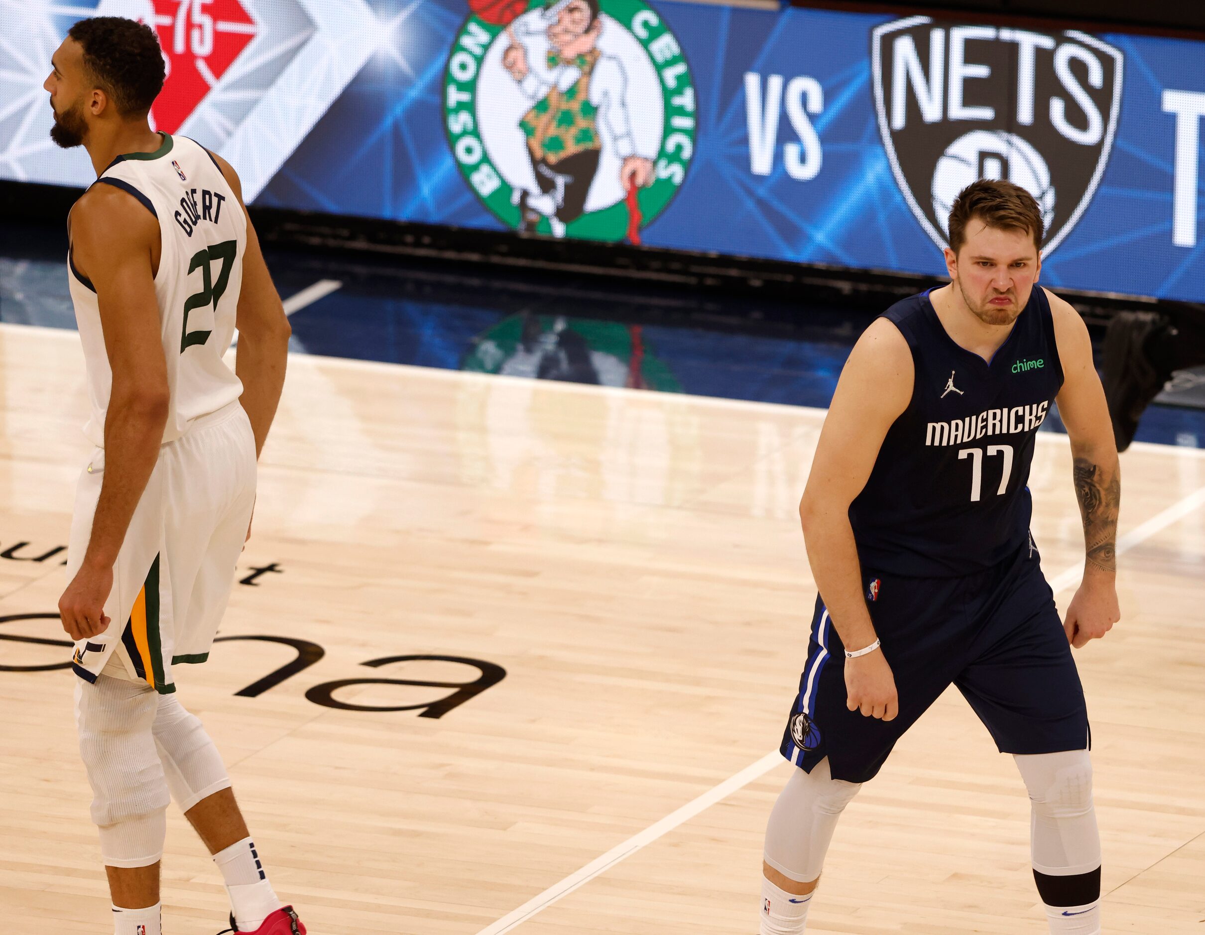 Dallas Mavericks guard Luka Doncic (77) celebrates after making a three pointer in front of...