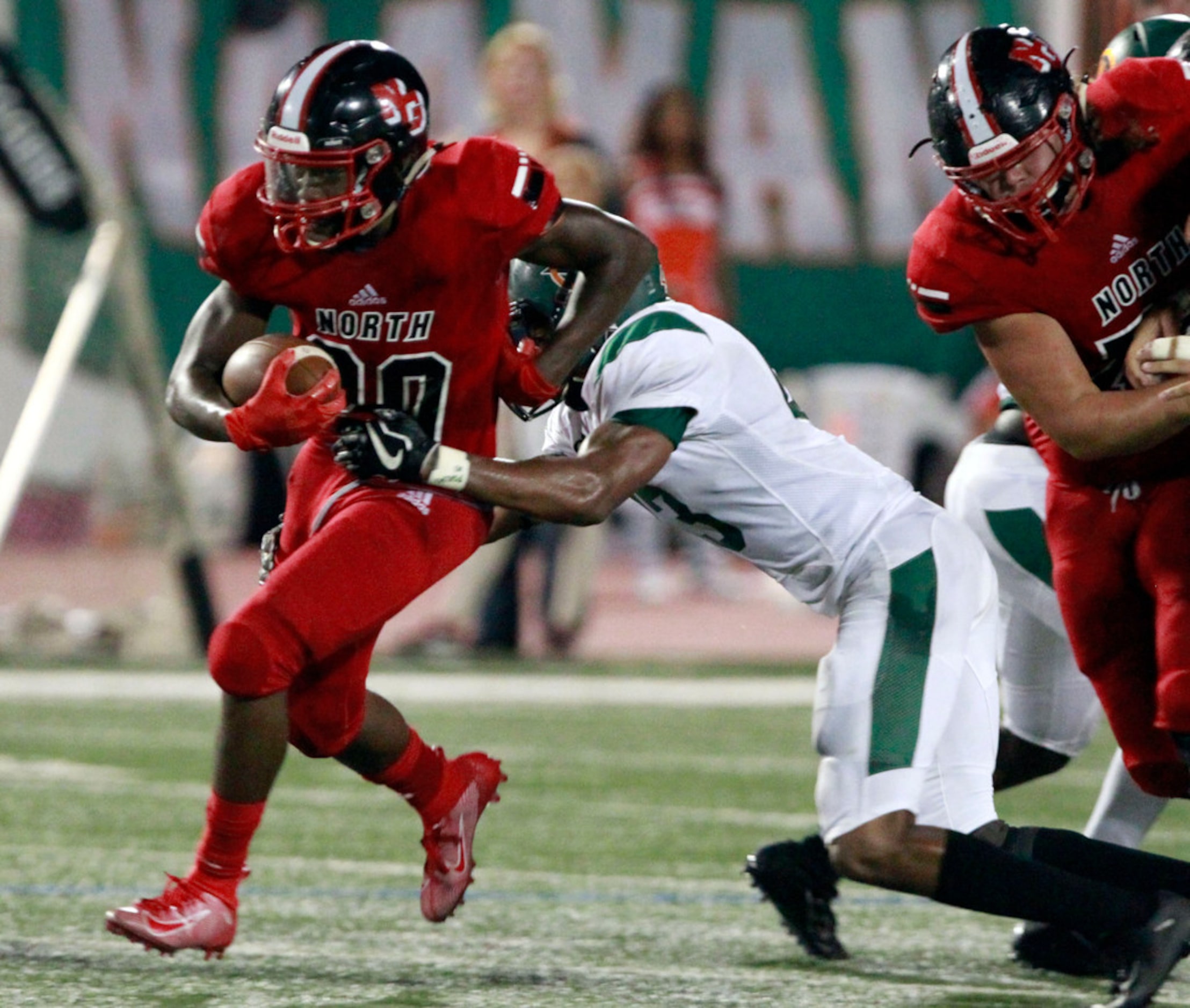 North Garland RB Sabron Woods (20) picks up a first down during the first half of the...