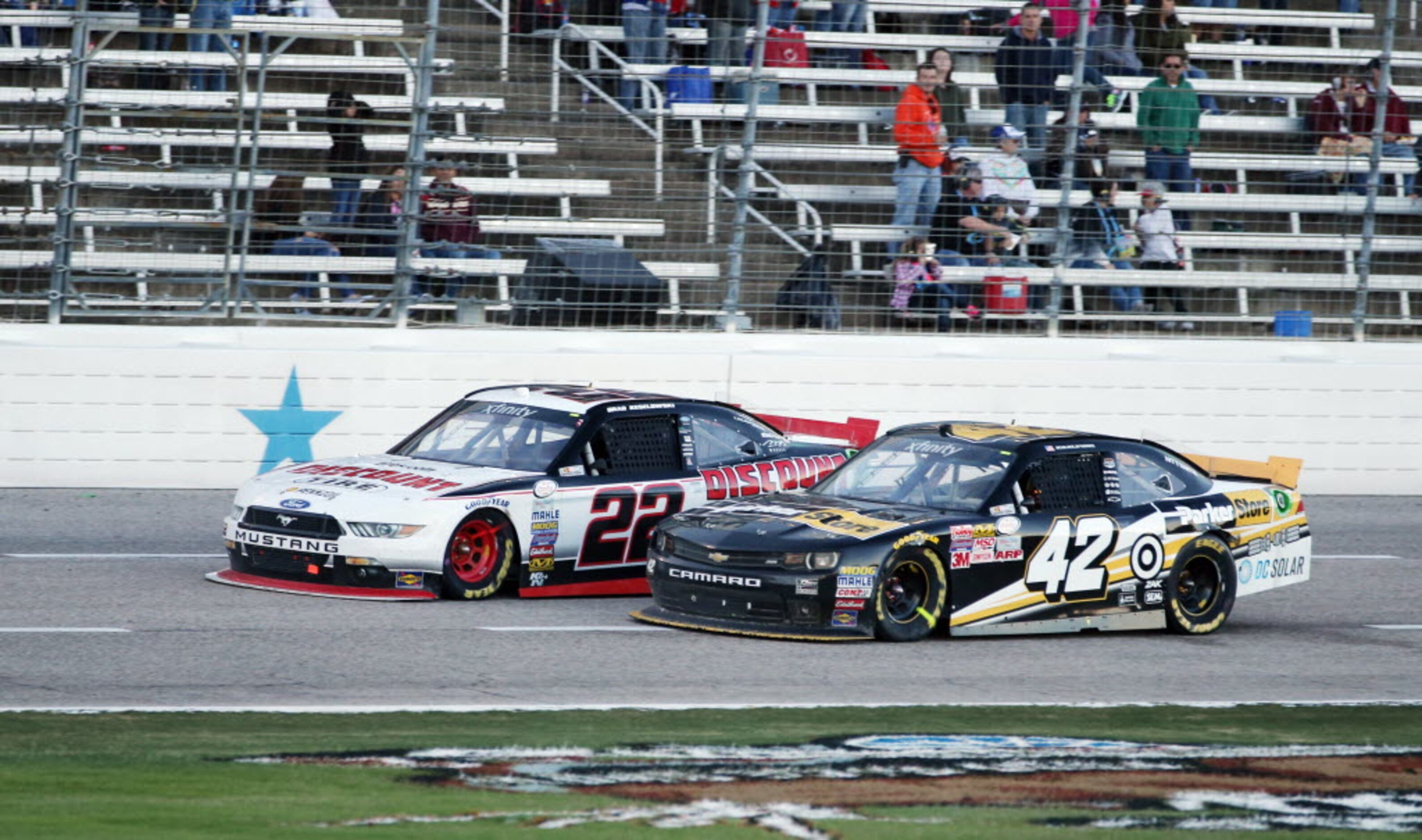 Brad Keselowski (22) and Kyle Larson (42) race during the NASCAR XFINITY SERIES 11th Annual...