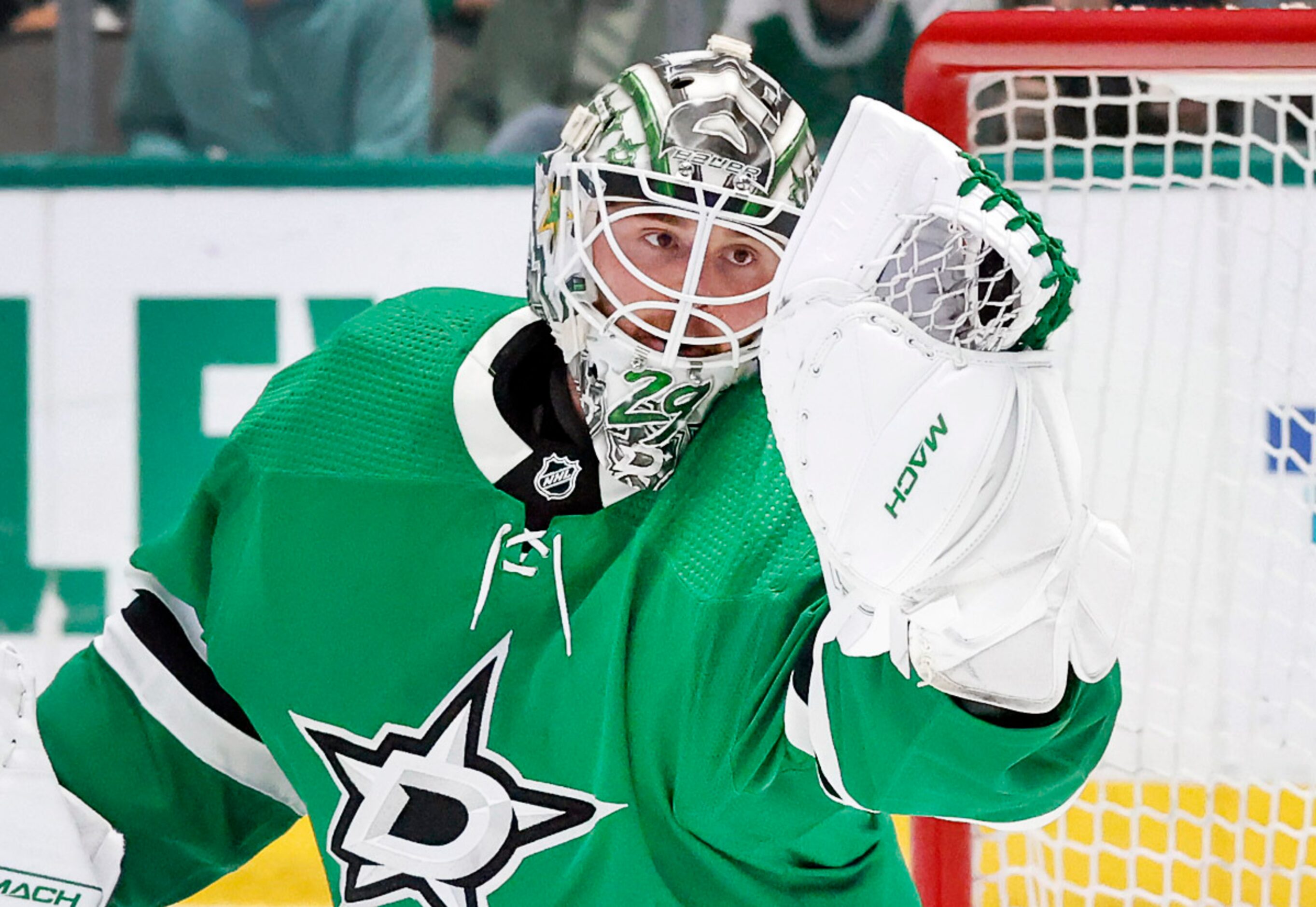 Dallas Stars goaltender Jake Oettinger (29) gloves a Seattle Kraken shot during the second...