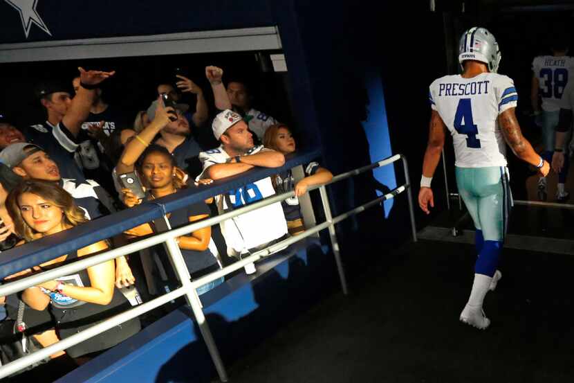 Dallas Cowboys quarterback Dak Prescott (4) walks to the locker room after running out of...