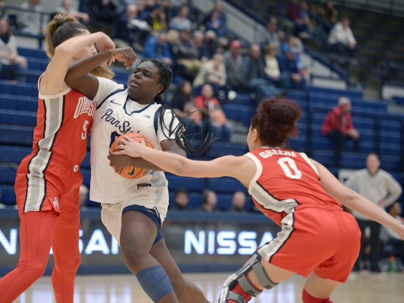 Ohio State's Madison Greene (0) strips the ball from Penn State's Ashley Owusu, center, who...