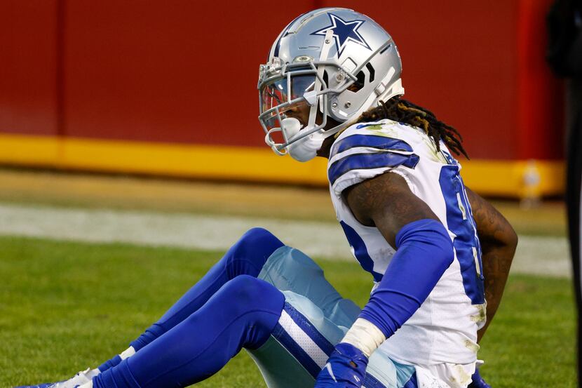 Dallas Cowboys wide receiver CeeDee Lamb (88) sits in the end zone after an interception...