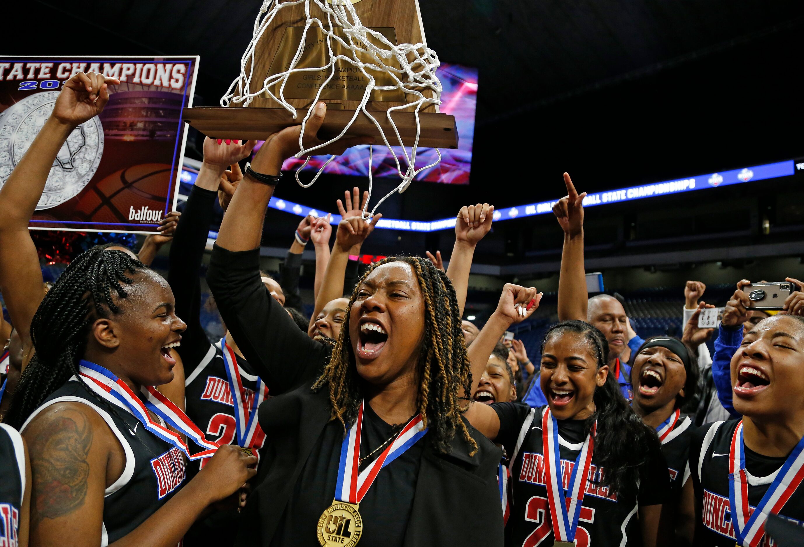 Duncanville head coach Lajeanna Howard holds the Trophy in a 6A final on  Saturday, March 7,...