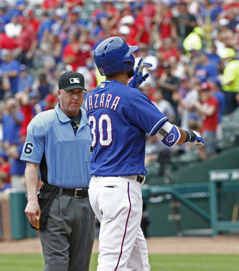 Texas Rangers right fielder Nomar Mazara (30) celebrates after hitting a home run off of Los...
