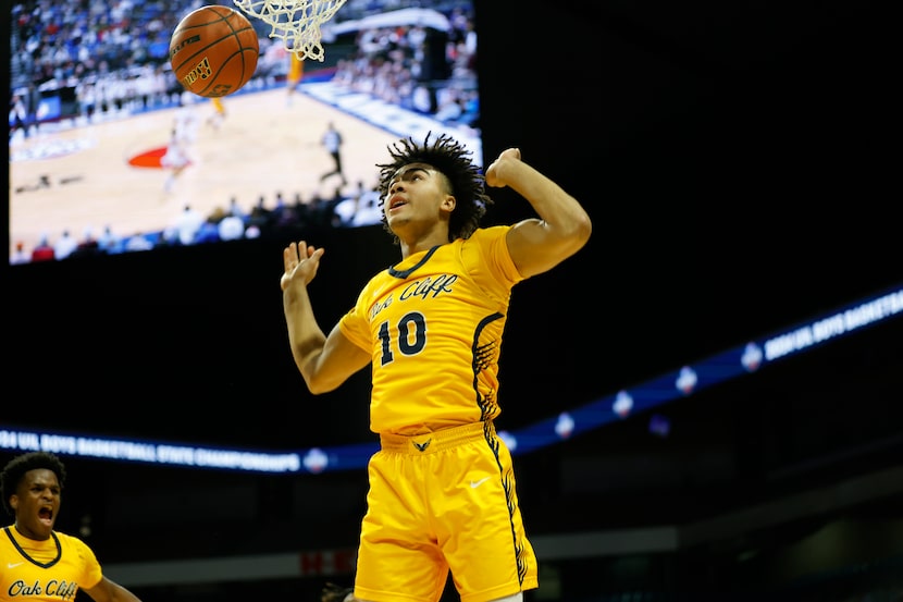 Oak Cliff Faith Family's Isaac Williams (10) dunks in the first half of the UIL Class 4A...