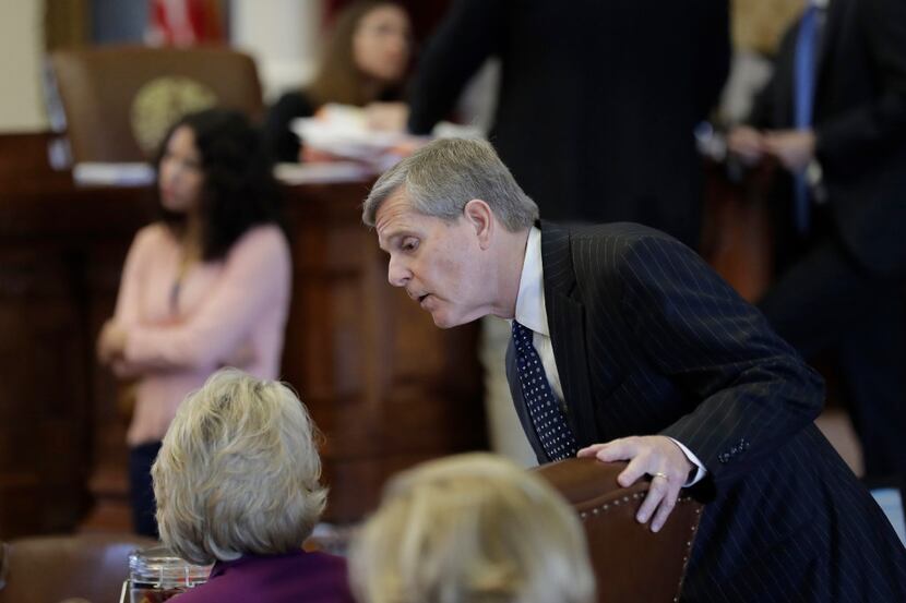 Texas Rep. Phil King, R-Weatherford, talked in late May with fellow lawmakers before debate...