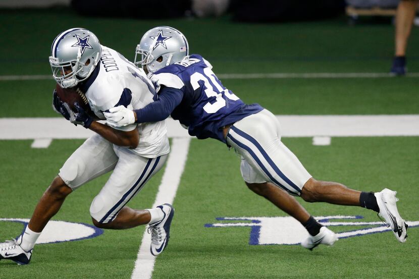 Dallas Cowboys wide receiver Amari Cooper (19) catches the ball in front of Dallas Cowboys...