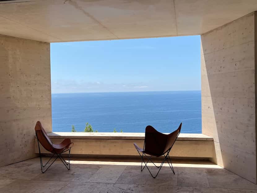 Loggia seating opens up to sea views at the Costa Brava residence of architects Enrique...