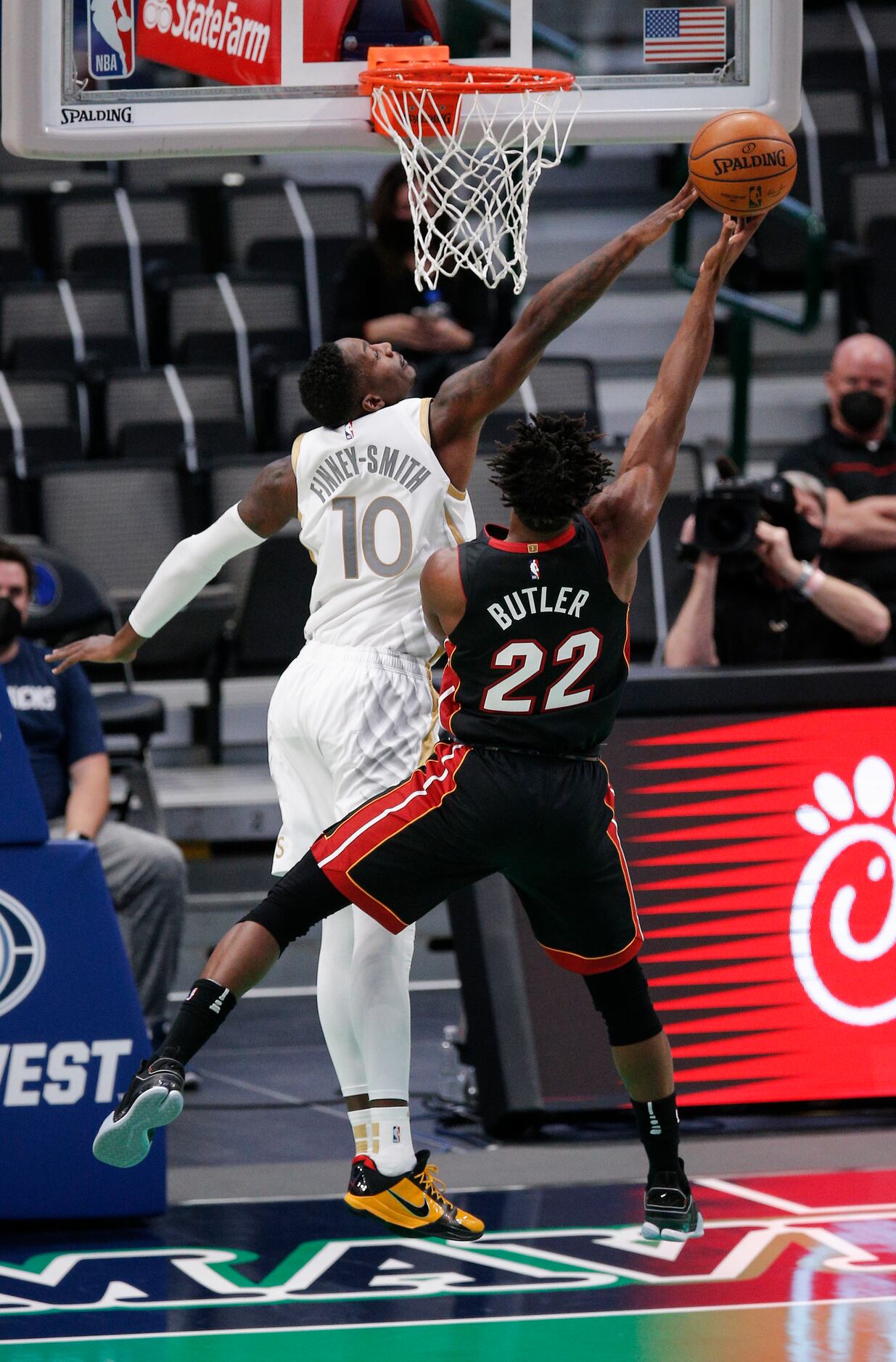 Miami Heat forward Jimmy Butler (22) attempts a layup as Dallas Mavericks forward Dorian...
