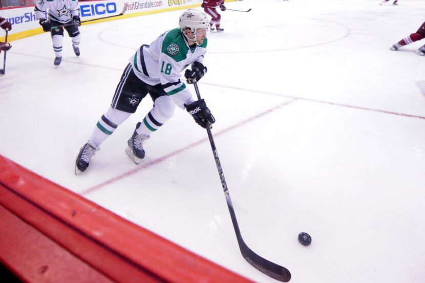 Apr 13, 2014; Glendale, AZ, USA; Dallas Stars right wing Chris Mueller (18) carries the puck...