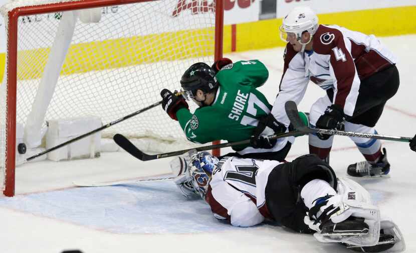 Dallas Stars center Devin Shore (17) gets the puck into the net scoring a goal against...