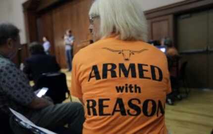  Professor Ann Cvetkovich waits to speak during a public forum at the University of Texas...