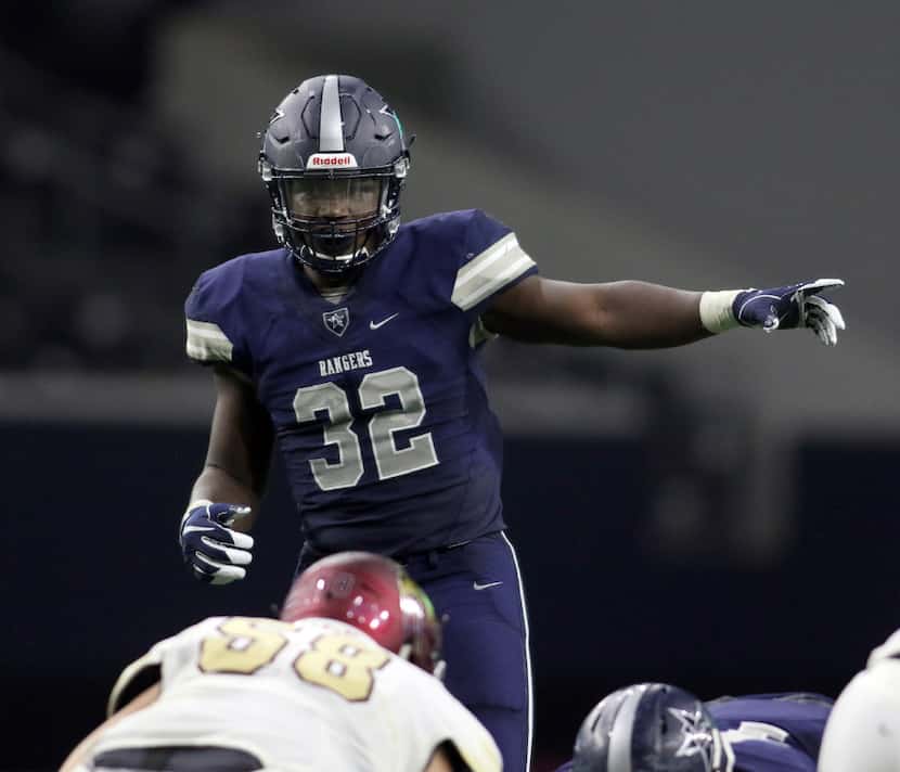 Frisco Lone Star linebacker Nicholas Bolton directs the defense against Frisco Heritage on...