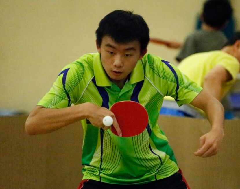
Jack Zhang, 16, of Denton, competes in a doubles match at the World Peace Table Tennis...