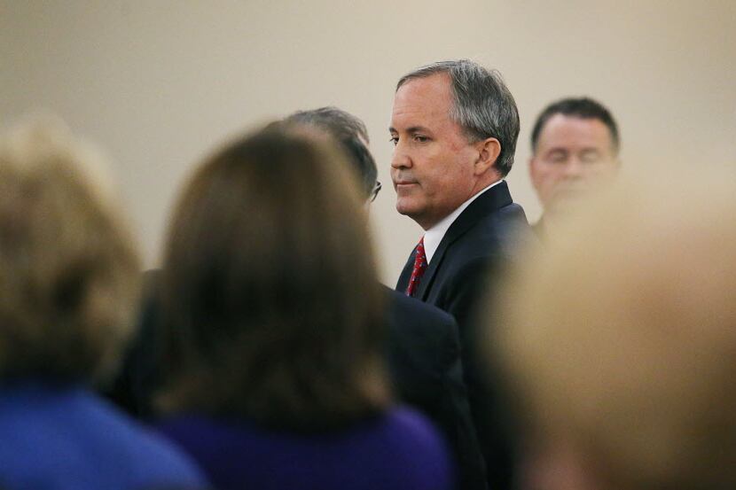 Texas Attorney General Ken Paxton, shown leaving court at the conclusion of his hearing on...
