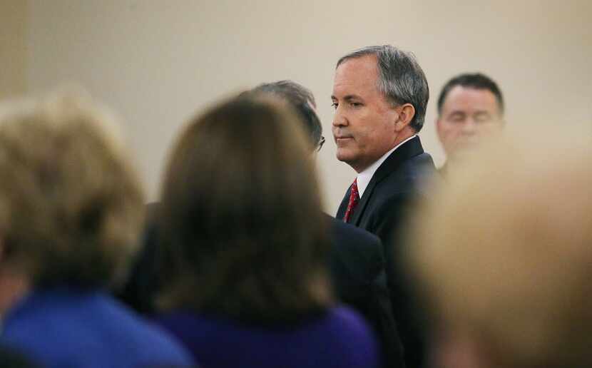Texas Attorney General Ken Paxton leaves court at the conclusion of his hearing on his...