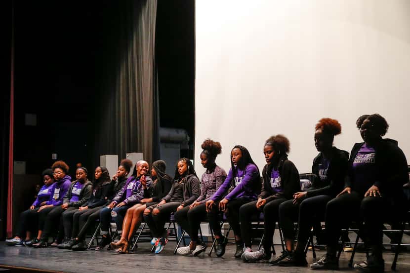 The girls basketball team lines the stage as Lincoln High School students gather for a pep...