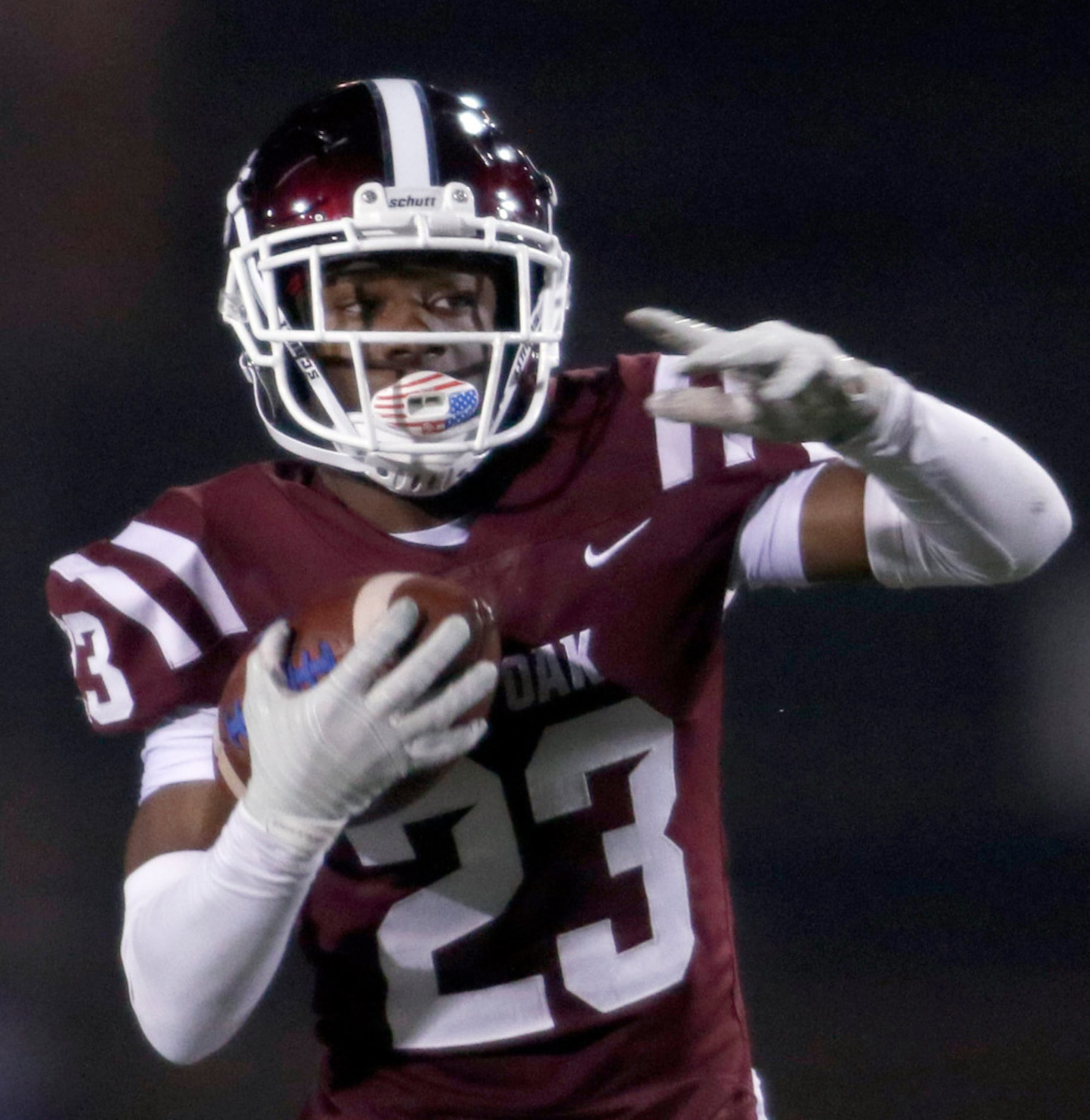 Red Oak defensive back Amarion Craddock (23) returns an interception during first quarter...