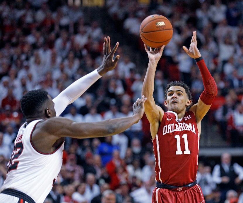 Oklahoma's Trae Young (11) shoots the ball over Texas Tech's Norense Odiase (32) during the...