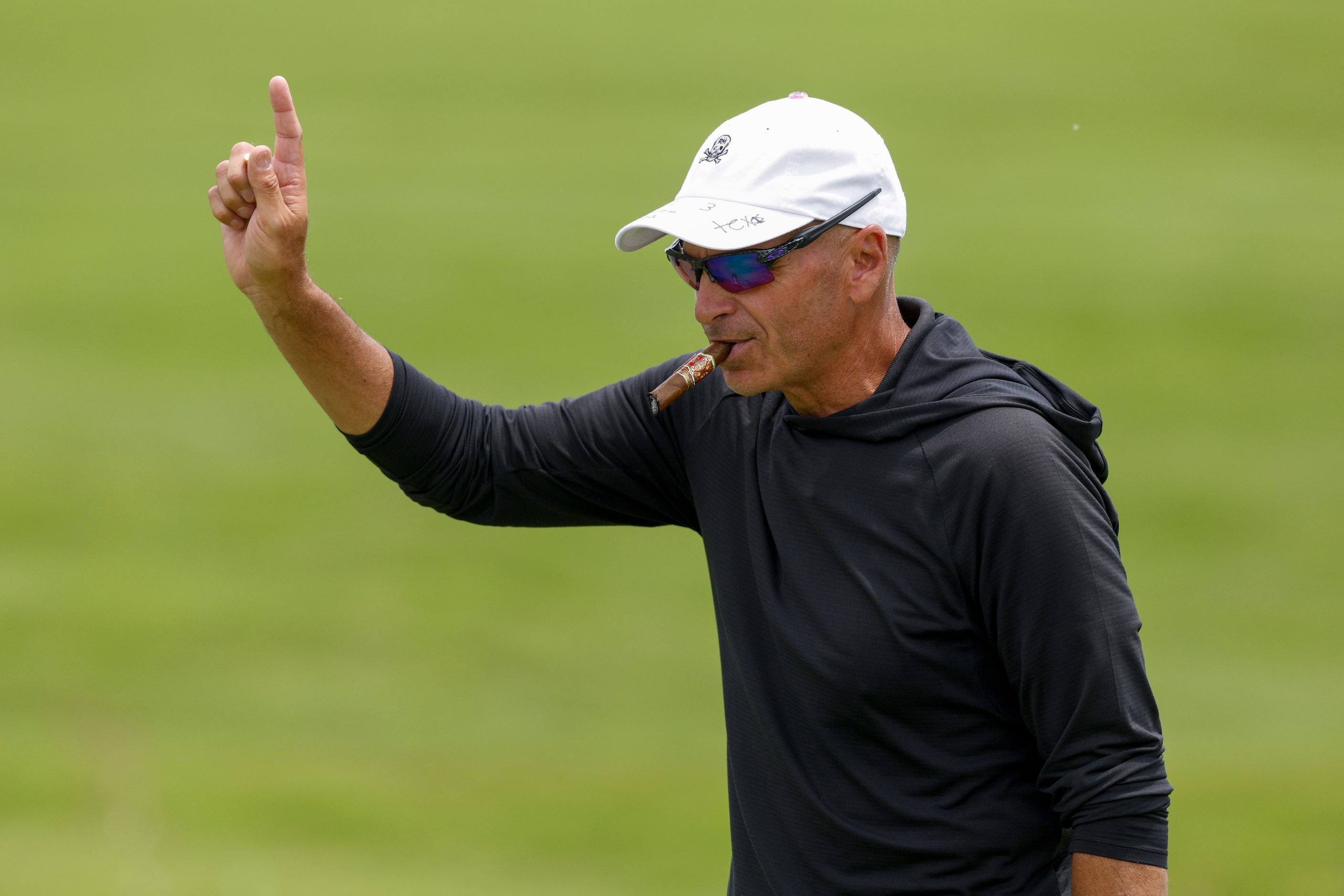 Rocco Mediate of the United States waves to fans on the 18th hole during the first round of...