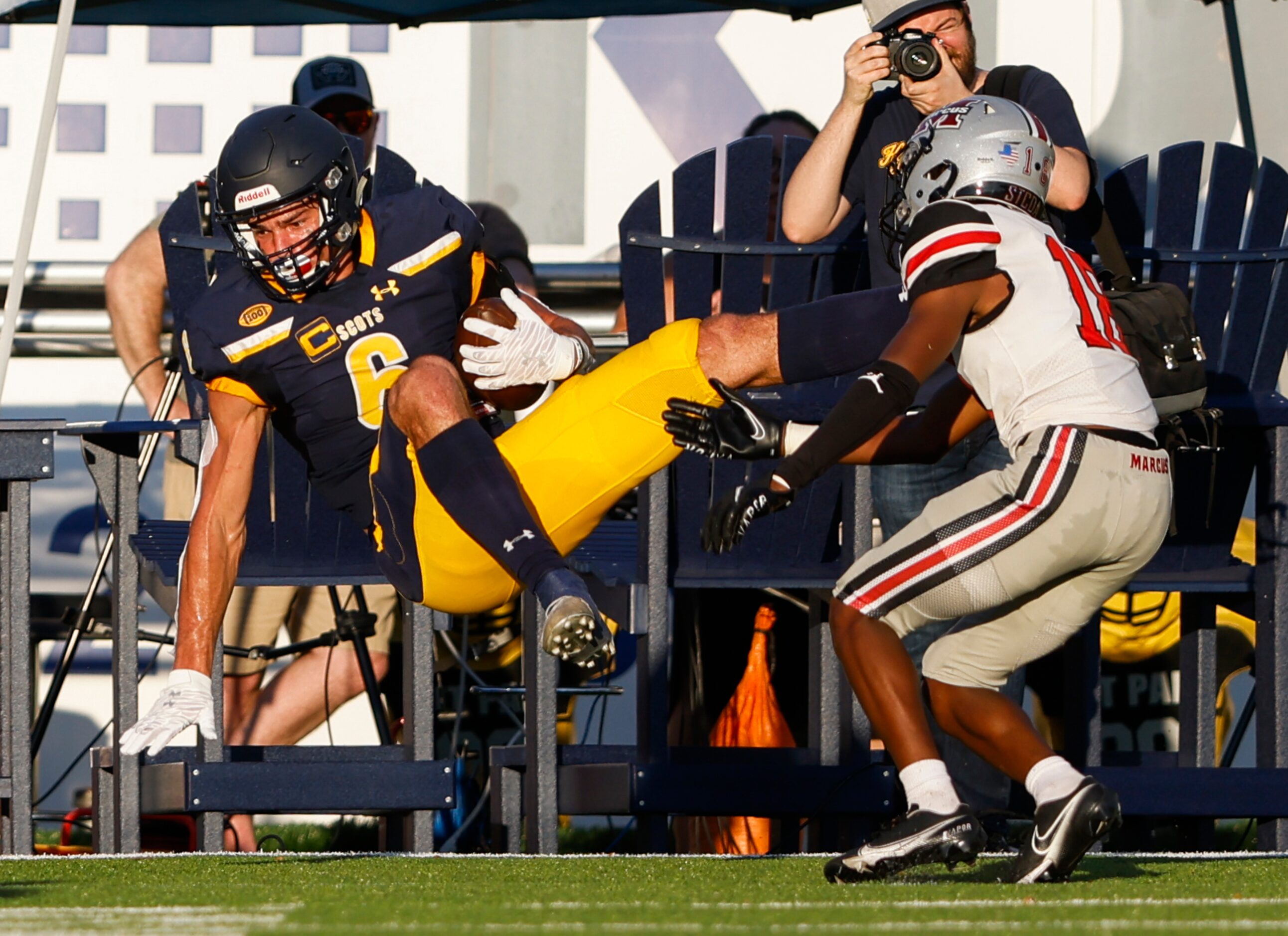 Highland Park wide receiver Luke Herring (6) falls into the end zone after catching a...