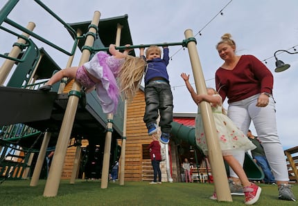 Kids here play at Hat Creek Burger Co. in McKinney. The playground at the new restaurant at...