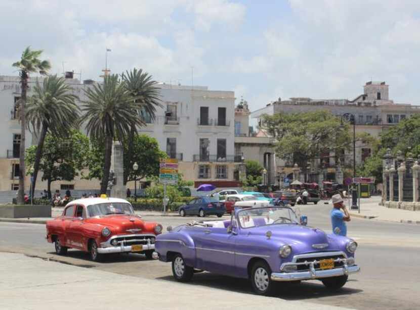 
The beloved Cuban taxis -- American cars, many gorgeously restored, from the 1950s, before...