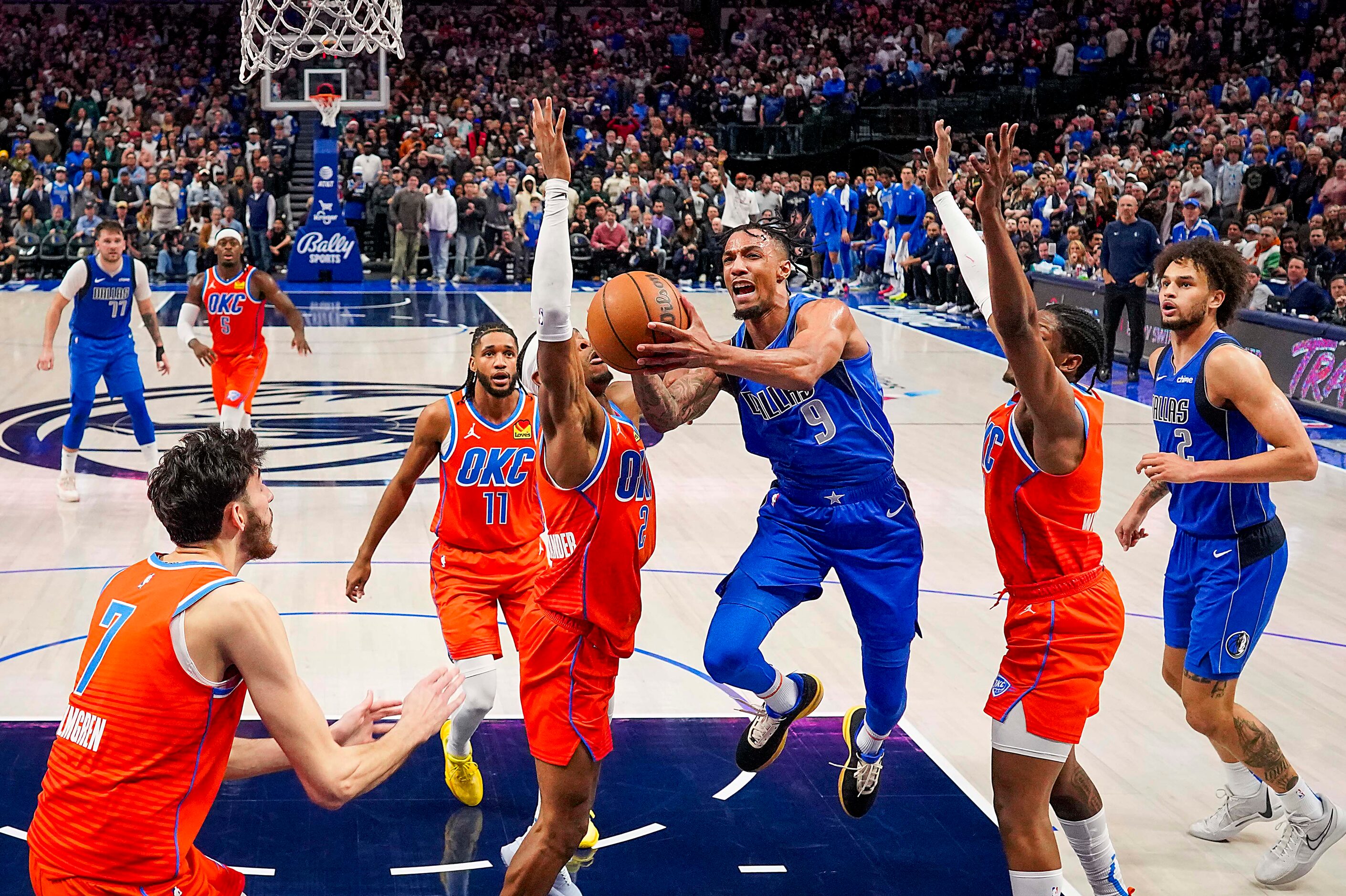 Dallas Mavericks guard A.J. Lawson (9) drives to the basket against Oklahoma City Thunder...