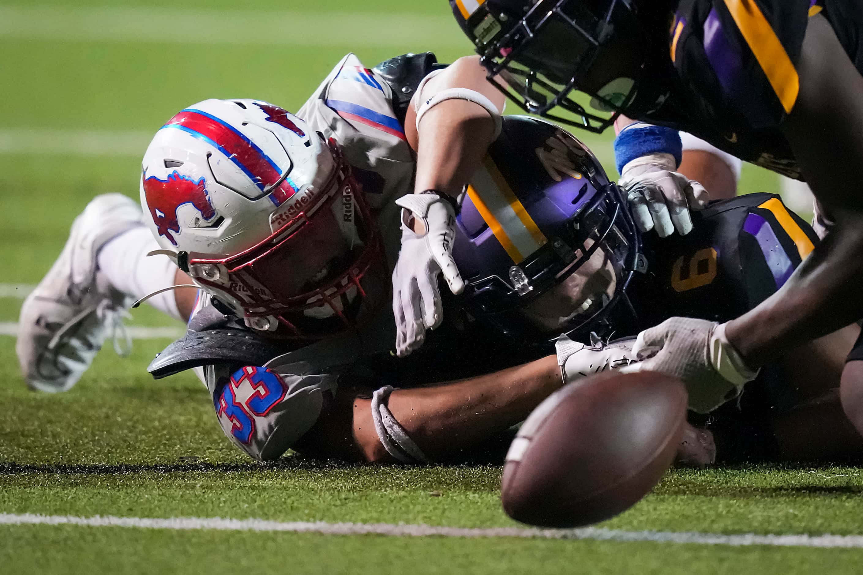 Richardson quarterback Cole Cage (6) watches a fumble bounce away after a hit from...