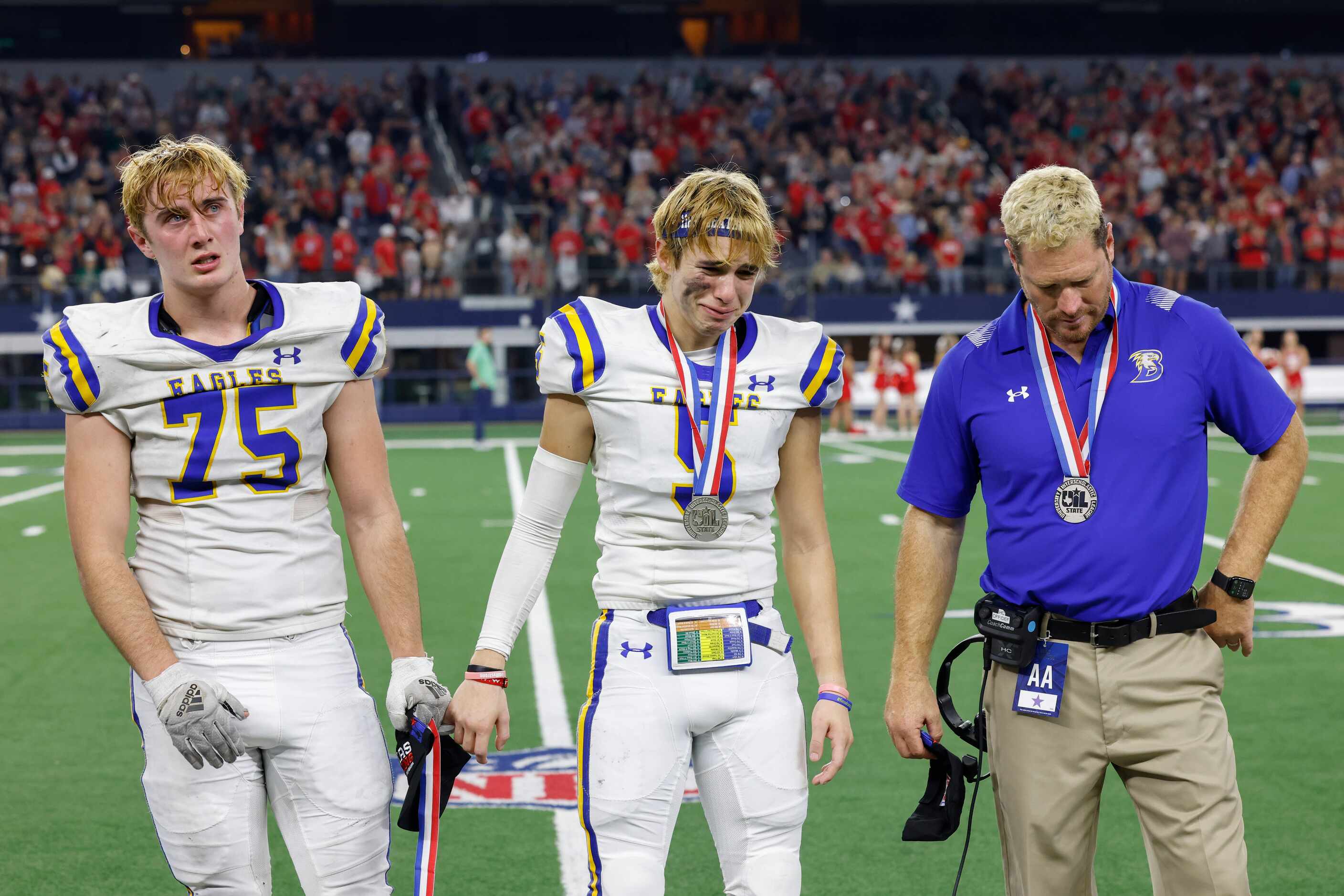 Brock defensive lineman Kadyn Mathews (75) and Brock wide receiver Diego Hernandez (5) stand...