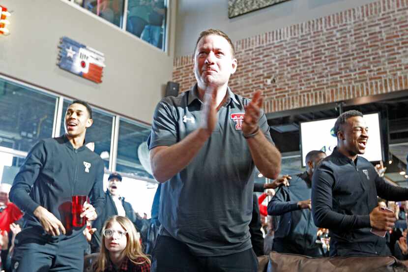 Texas Tech coach Chris Beard celebrates after finding out where the Red Raiders will play...