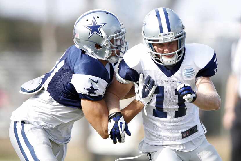 Dallas Cowboys wide receiver Cole Beasley (11) attempts to break away from Dallas Cowboys...
