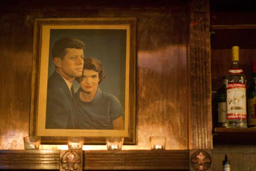 A portrait of John F. Kennedy and his wife, Jacqueline, hangs behind the bar at the Kennedy...
