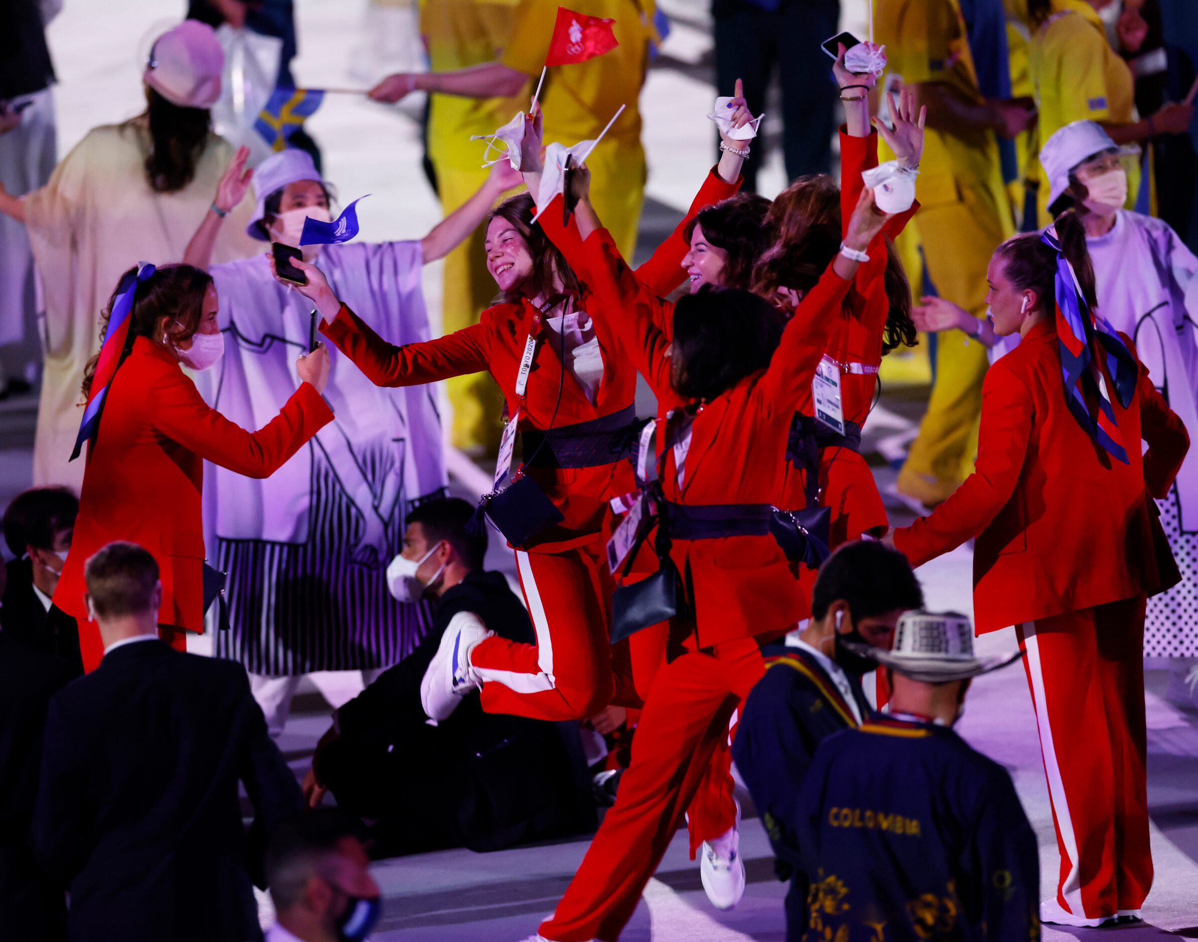 Russian Olympic Committee athletes take record of themselves after walking the stage during...