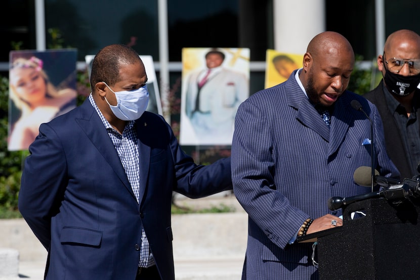 Mayor Eric Johnson (left) consoled Dallas ISD trustee Maxie Johnson as he became emotional...