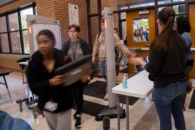 Students walk through the Evolv Express weapons detection system at Mansfield High School in...