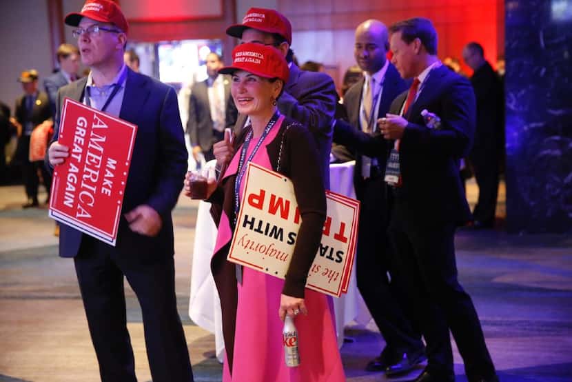 Republicans had smiles on their faces at a Donald Trump election party at the Midtown Hilton...