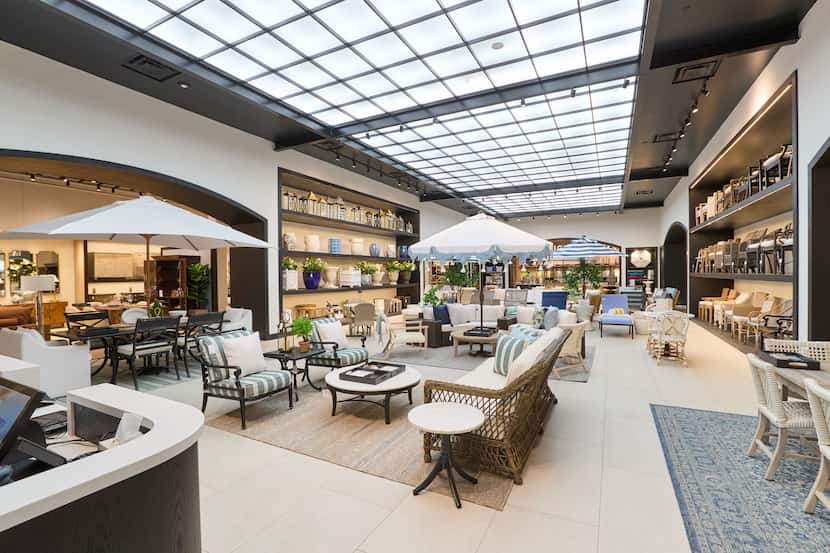 The main area of Frontgate's new store is all about outdoor living under an atrium lighting...