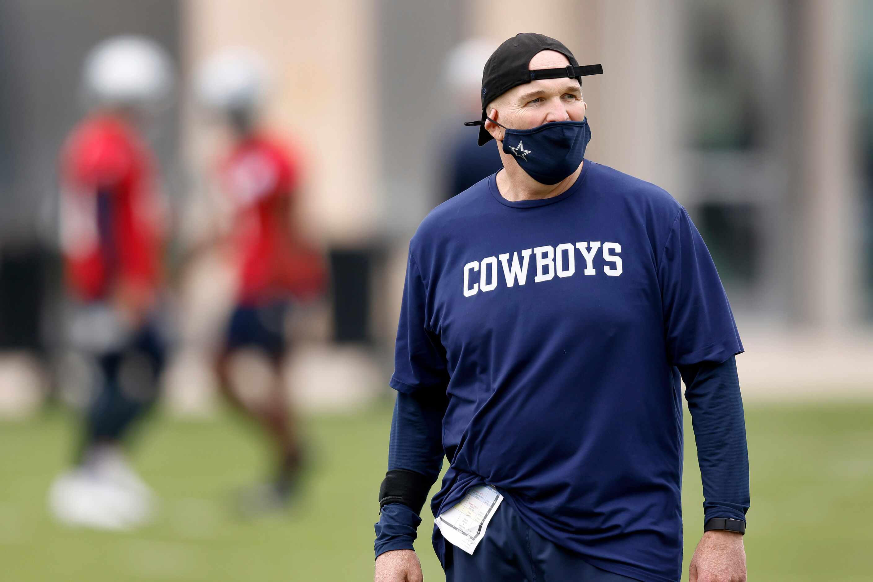 Dallas Cowboys defensive coordinator Dan Quinn watches his rookies go through minicamp at...