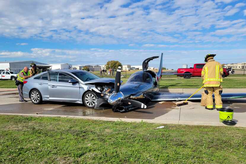 This photo provided by the McKinney Fire Department shows officials at the site of a crash...