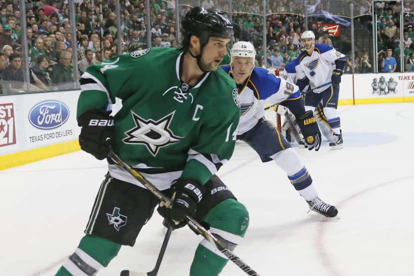 Dallas' Jamie Benn (14) maneuvers the puck in the offensive zone in the third period during...