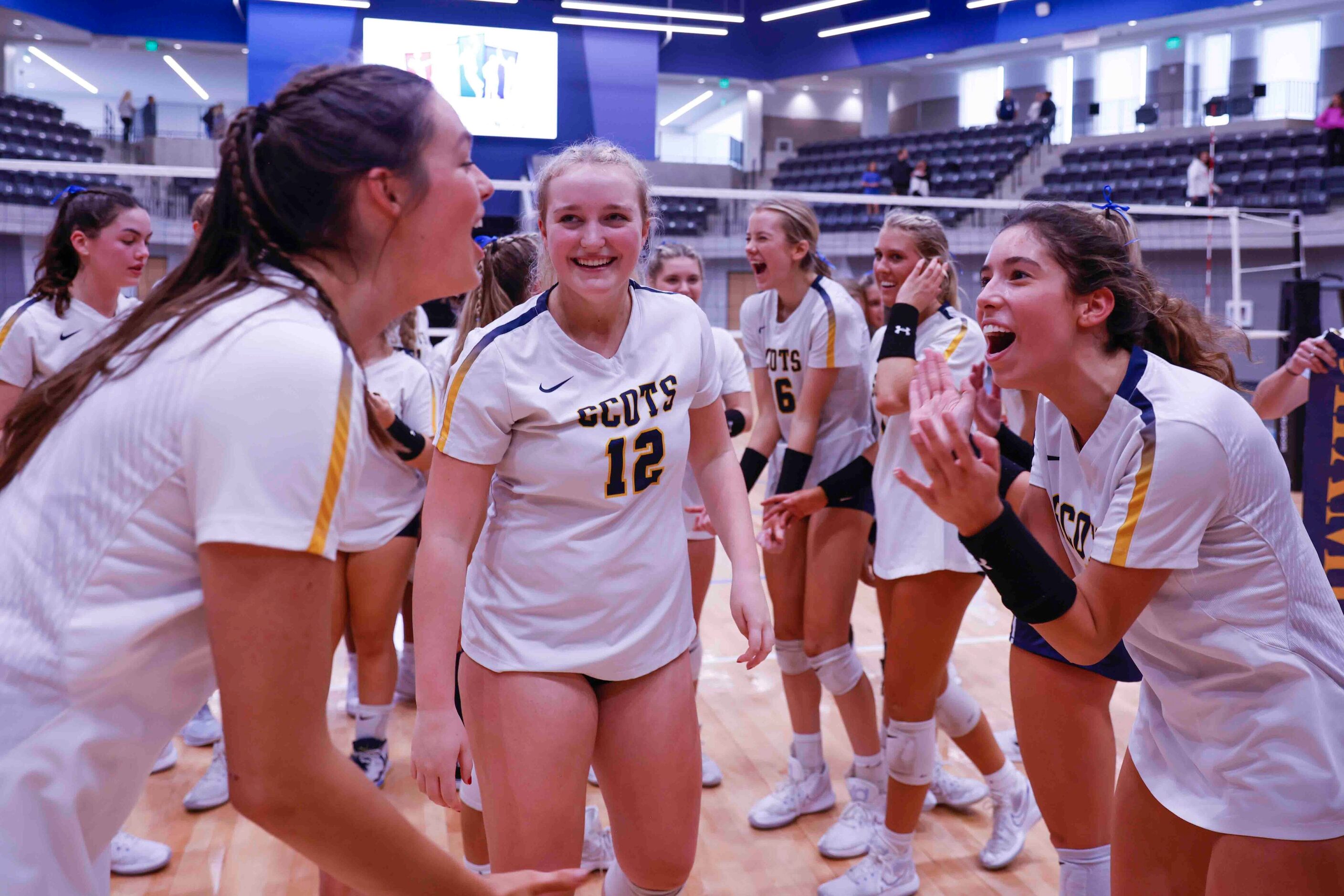 Highland Park players celebrate after winning against Flower Mound during a volleyball game...