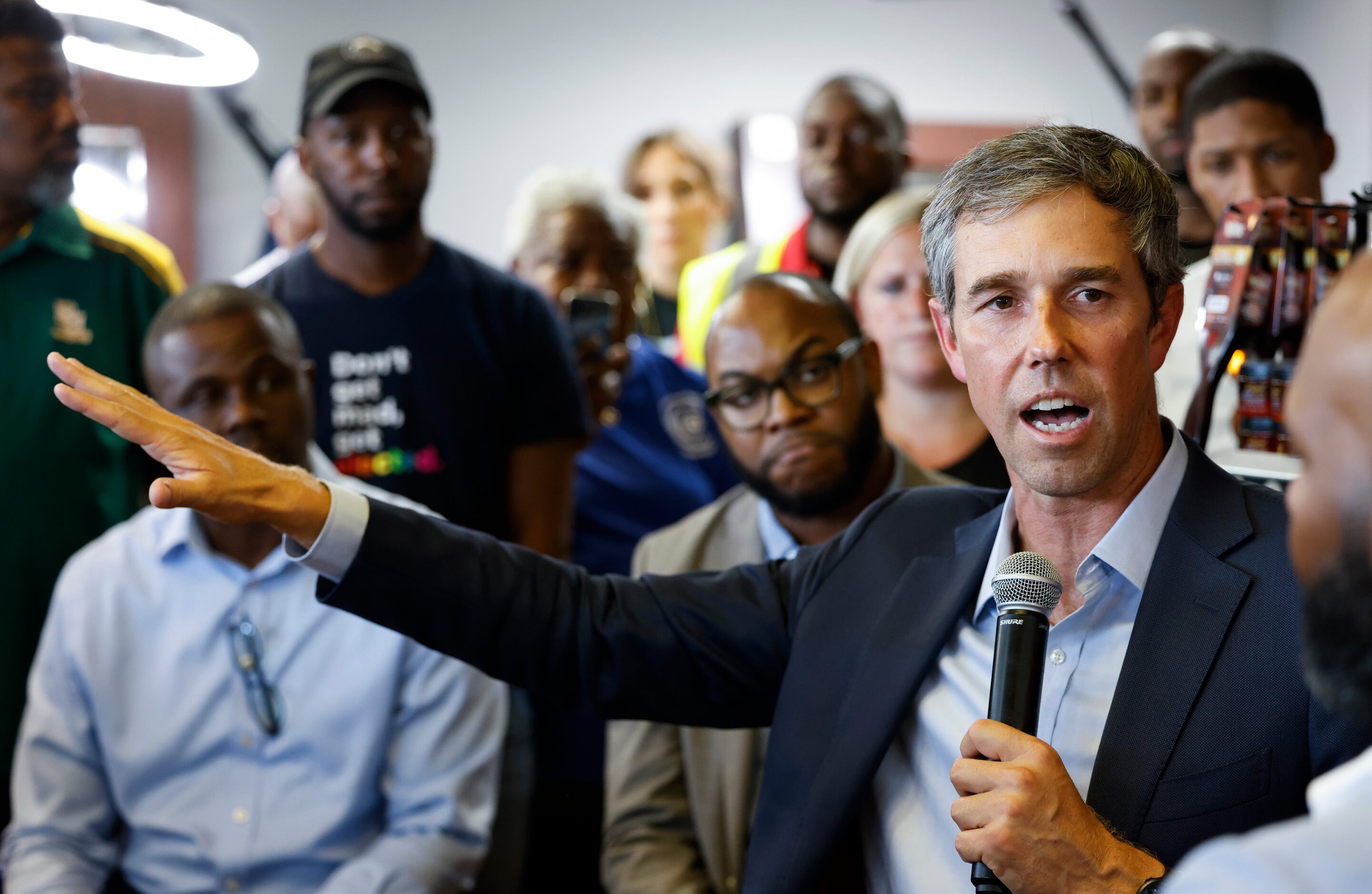 Texas Governor candidate Beto O'Rourke talks to patrons at Kutinfed Barbershop in Dallas on...