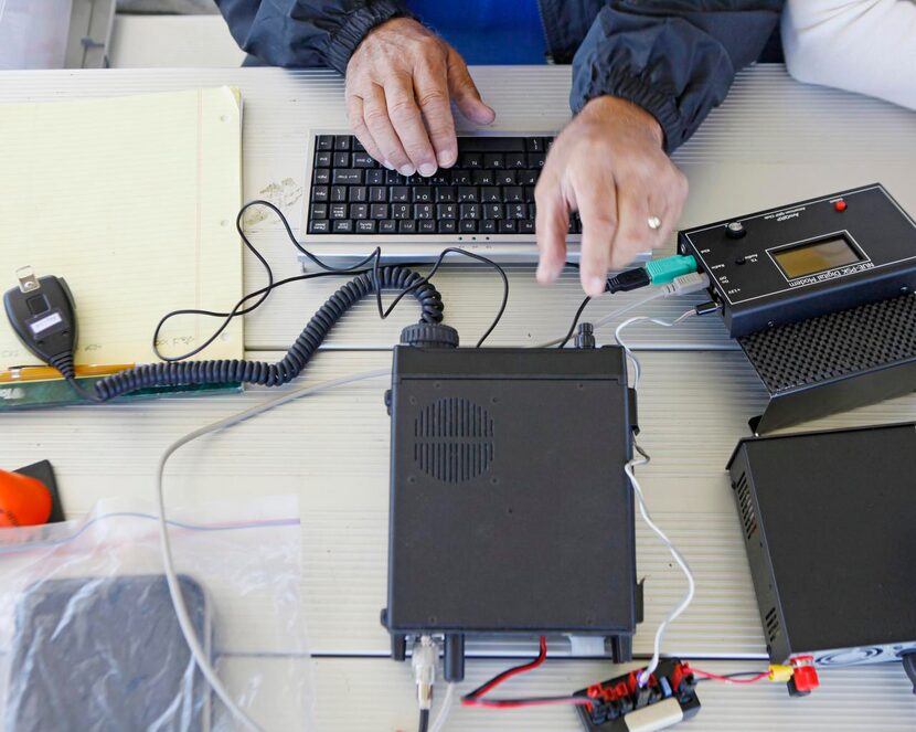 
Darrell Crimmins, 68, of Carroltton, uses a Phase Shift Keying digital device used to send...